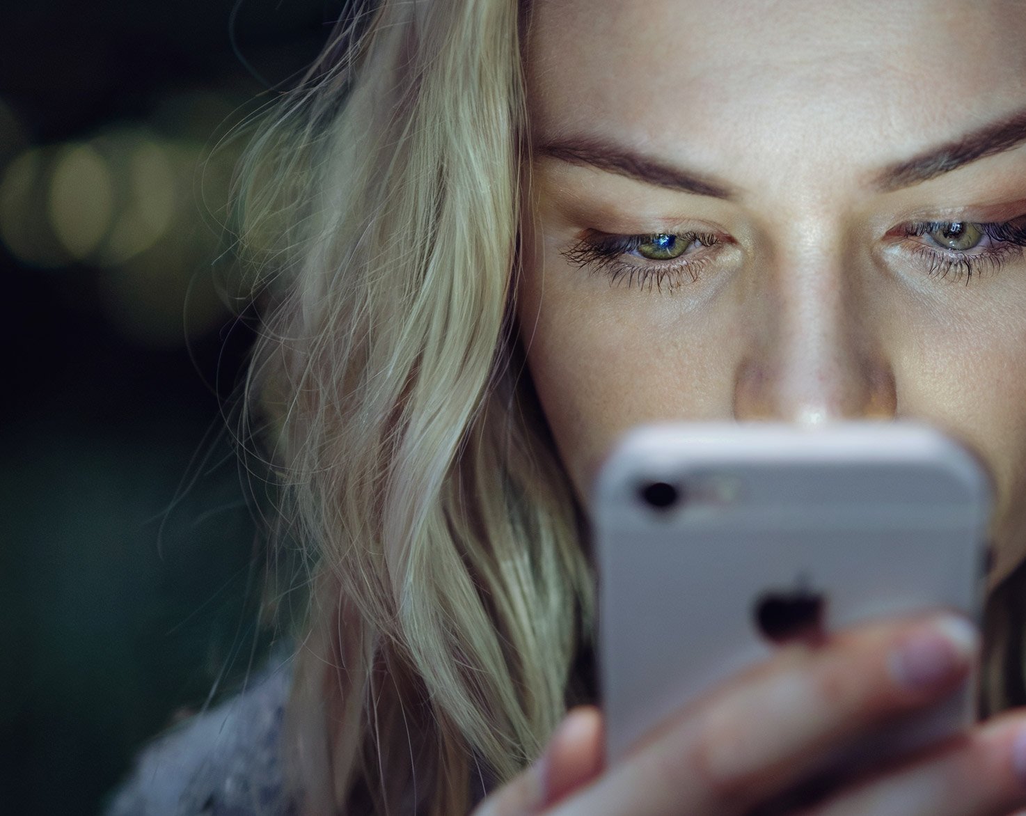 Picture of woman looking at her smart phone